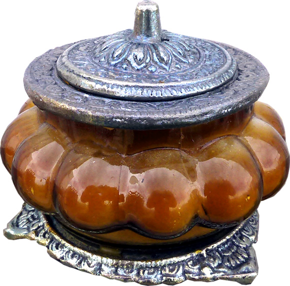 Opium flower scented candle in a rustic handmade glass & metal jar