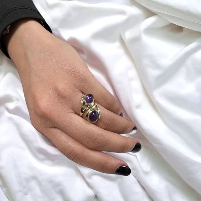 Adjustable bronze ring with two amethyst stones